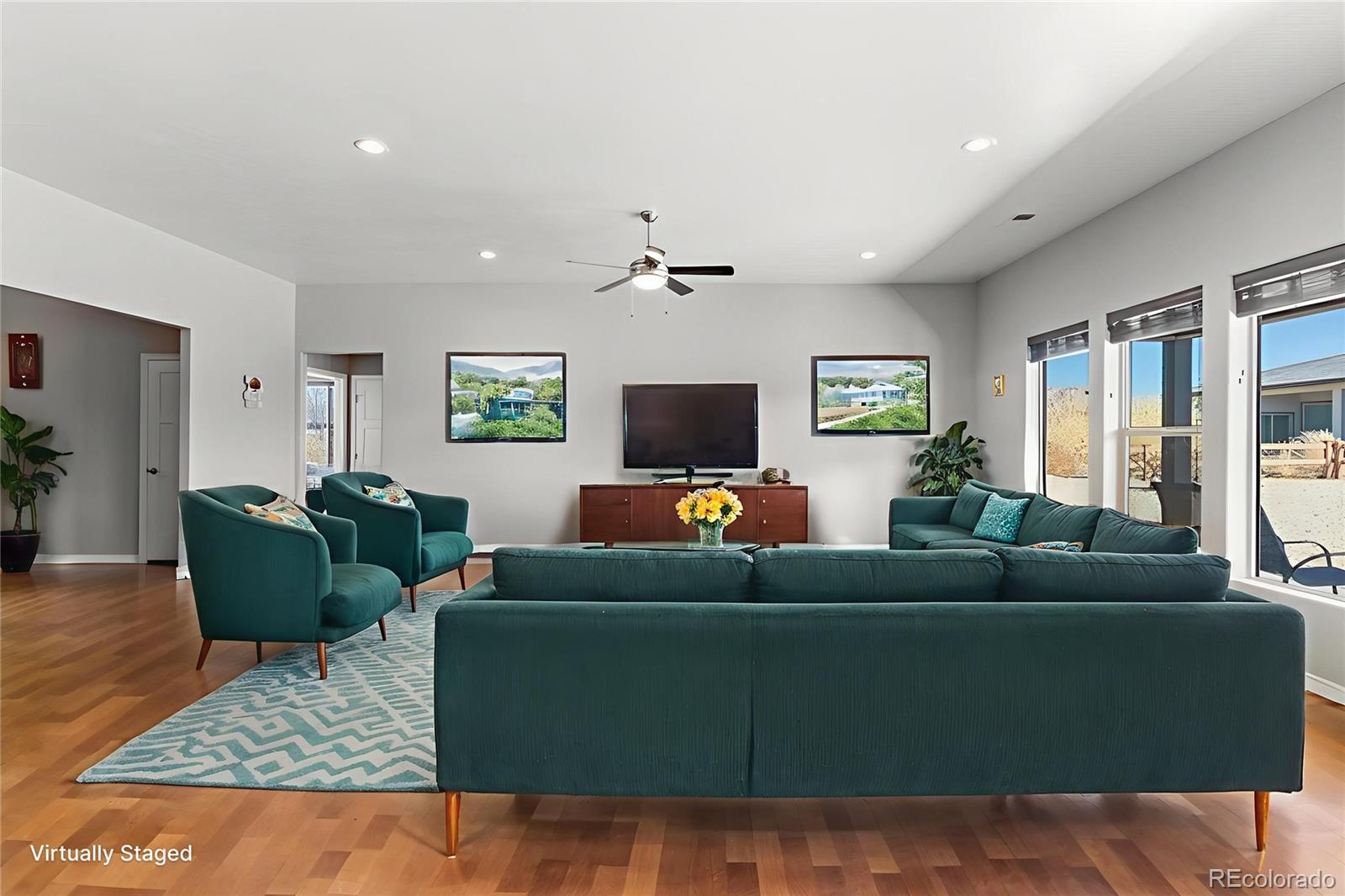 1326 Fairway Drive Fruita, CO 81521 - Photo 3 of 22 a living room with furniture and a flat screen tv