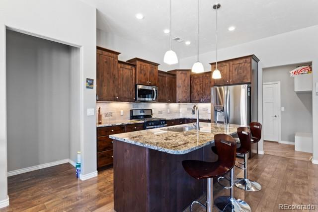1326 Fairway Drive Fruita, CO 81521 - Photo 8 of 22 a kitchen with a refrigerator a stove a sink and chairs