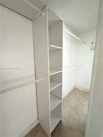 a bathroom with a toilet sink and a mirror