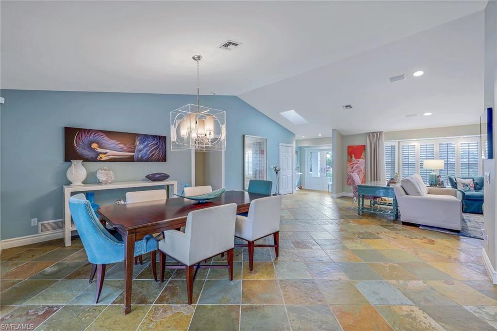 2113 Imperial Golf Course Boulevard Naples, FL 34110 - Photo 16 of 42 a view of a dining room with furniture