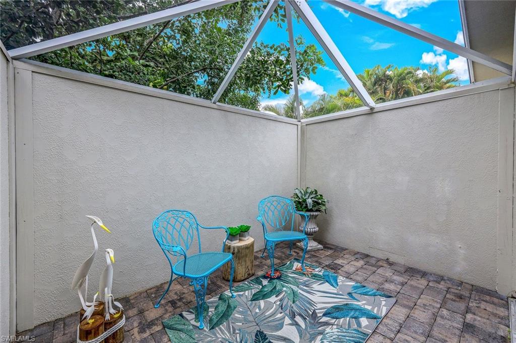 2113 Imperial Golf Course Boulevard Naples, FL 34110 - Photo 23 of 42 a view of a chair in a patio