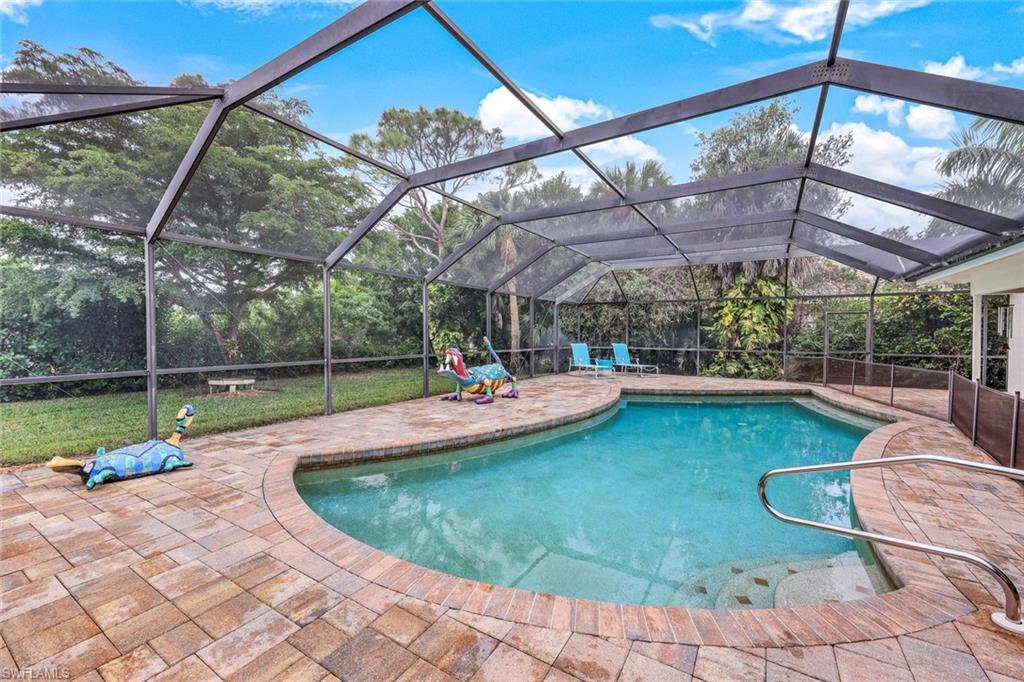 2113 Imperial Golf Course Boulevard Naples, FL 34110 - Photo 32 of 42 a view of a swimming pool with a patio