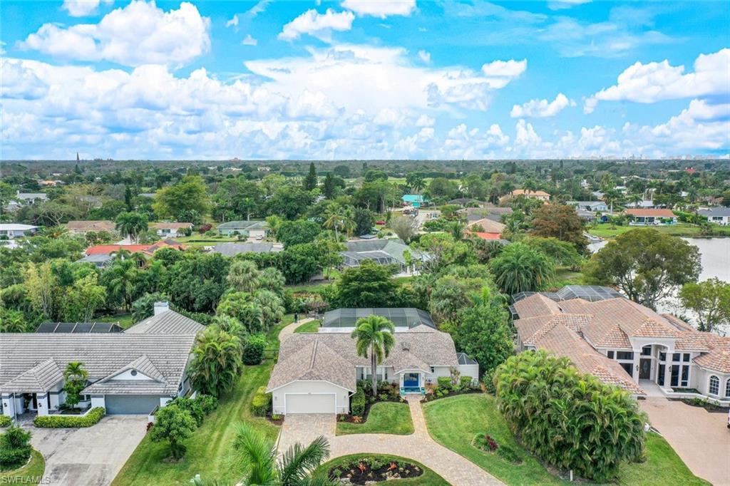 2113 Imperial Golf Course Boulevard Naples, FL 34110 - Photo 41 of 42 an aerial view of a house with a garden