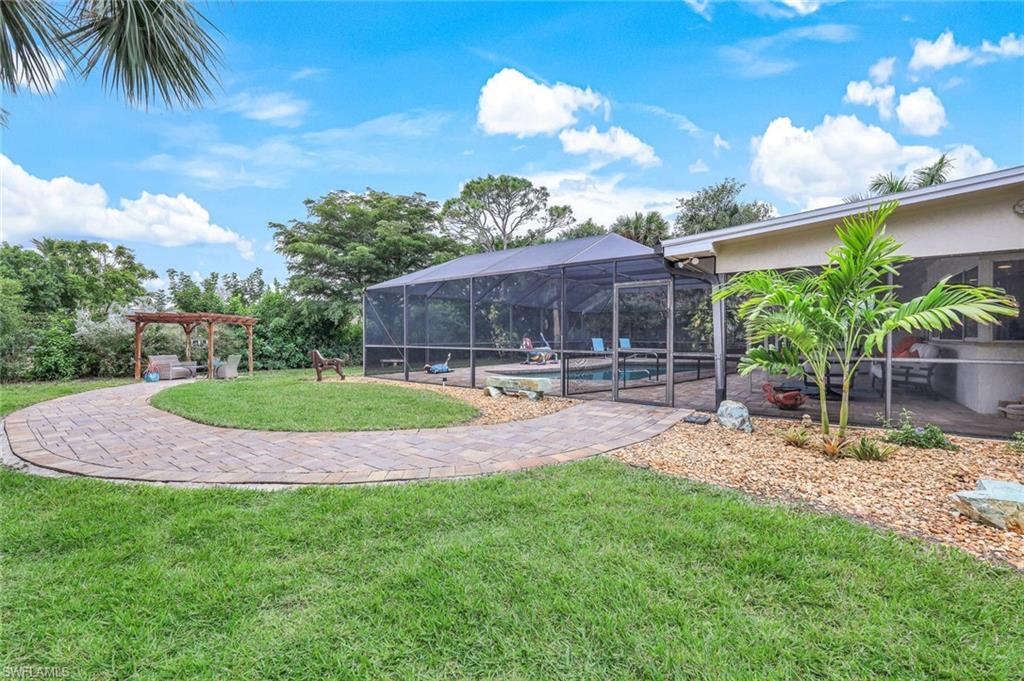 2113 Imperial Golf Course Boulevard Naples, FL 34110 - Photo 5 of 42 a view of a house with backyard and sitting area