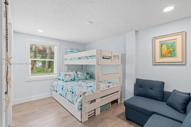 a bedroom with a bed and a couch