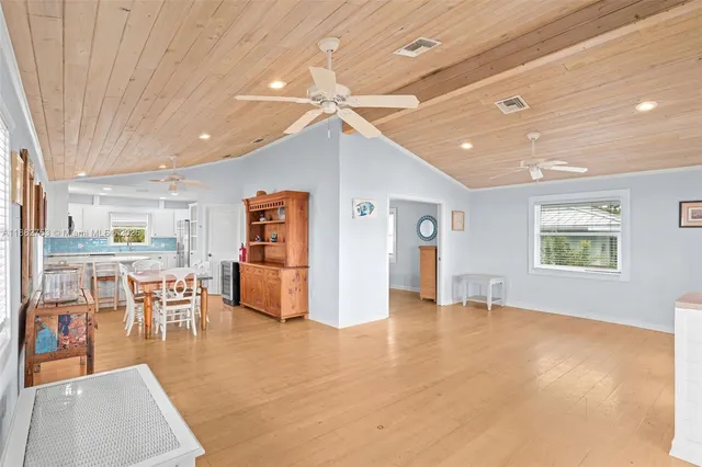 a view of a livingroom with furniture and a ceiling fan