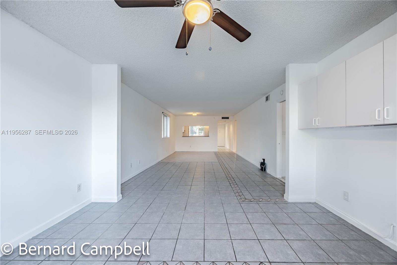 7264 South Devon Drive, Unit 112 Tamarac, FL 33321 - Photo 11 of 45 a view of empty room with wooden floor
