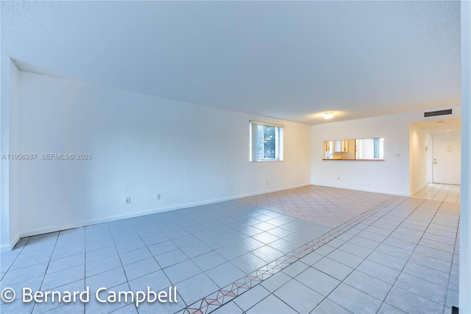 7264 South Devon Drive, Unit 112 Tamarac, FL 33321 - Photo 12 of 45 an empty room with windows