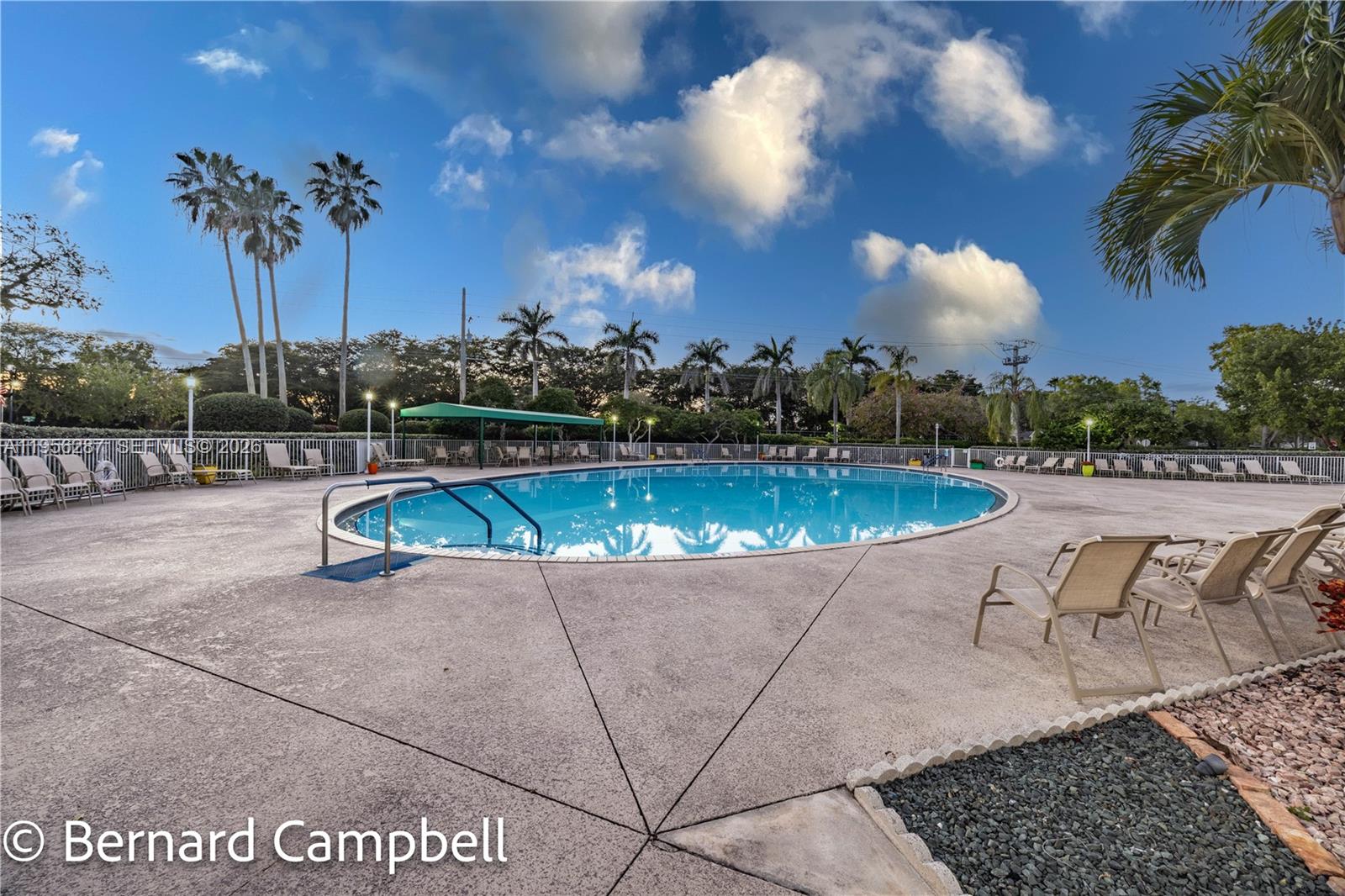 7264 South Devon Drive, Unit 112 Tamarac, FL 33321 - Photo 35 of 45 a view of swimming pool with outdoor seating and plants