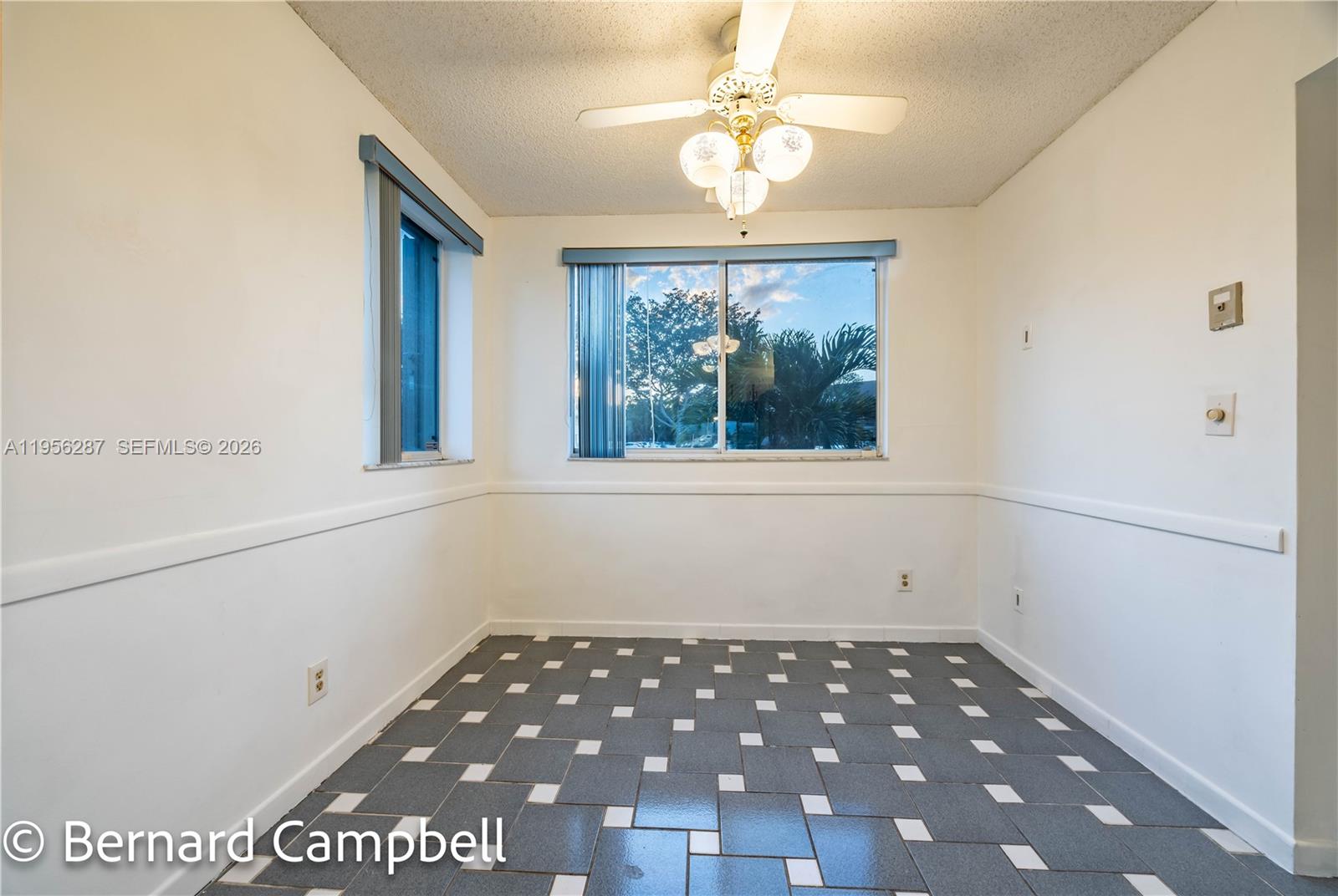 7264 South Devon Drive, Unit 112 Tamarac, FL 33321 - Photo 5 of 45 a view of an empty room with a window