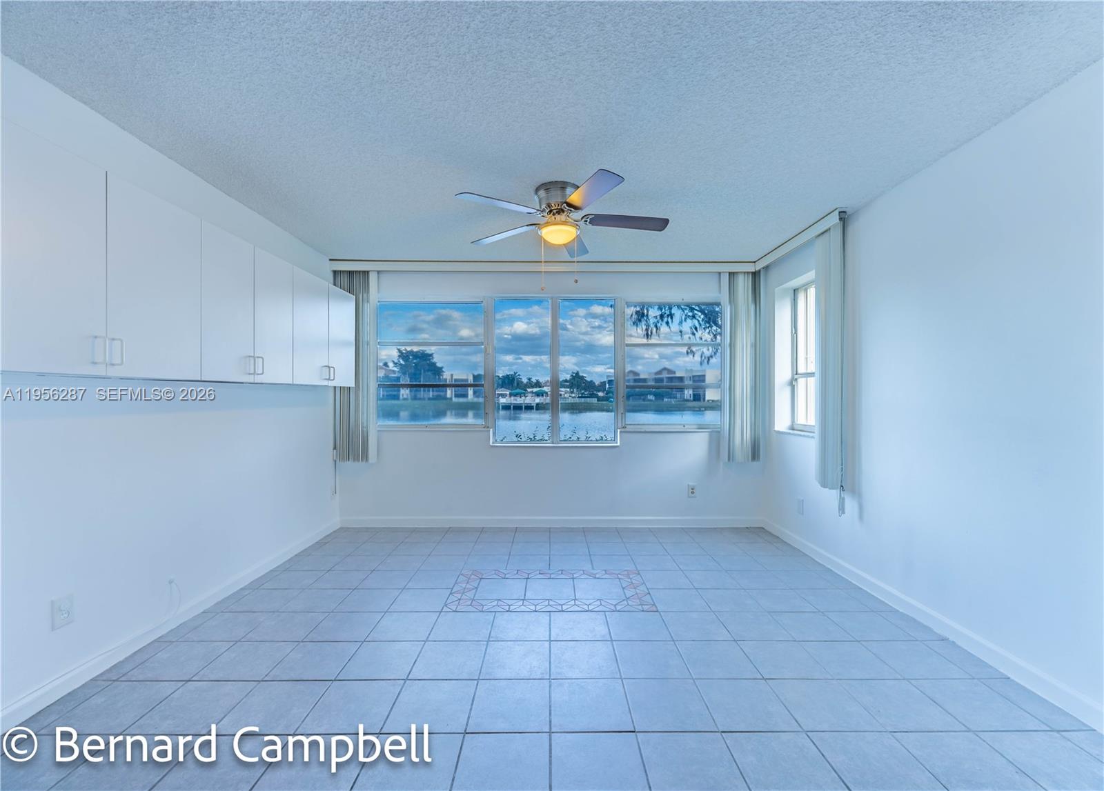 7264 South Devon Drive, Unit 112 Tamarac, FL 33321 - Photo 9 of 45 a view of an empty room with a window
