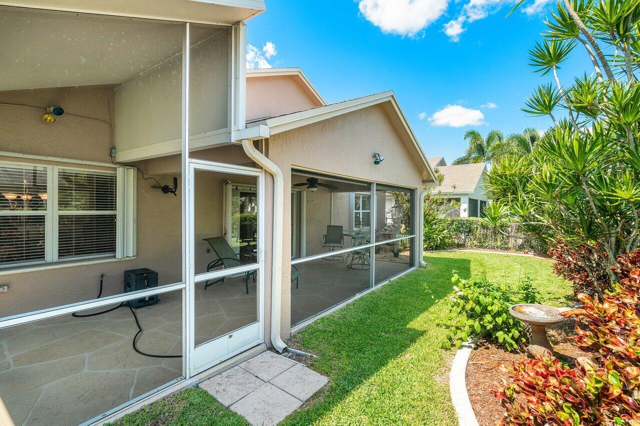 1410 Bethpage Way Greenacres, FL 33413 - Photo 25 of 29 a view of an house with backyard porch and entertaining space