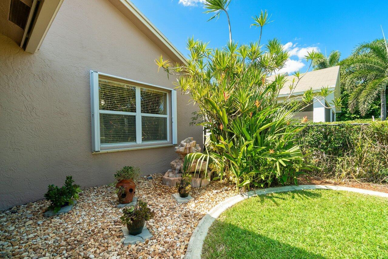 1410 Bethpage Way Greenacres, FL 33413 - Photo 26 of 29 a house with trees in front of it