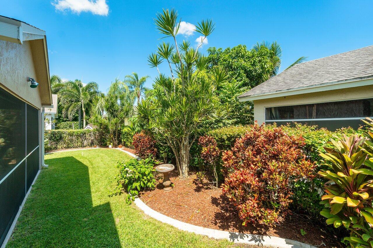 1410 Bethpage Way Greenacres, FL 33413 - Photo 27 of 29 a house view with a garden space