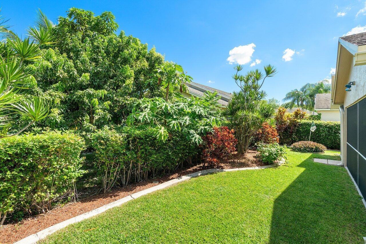 1410 Bethpage Way Greenacres, FL 33413 - Photo 28 of 29 a view of a yard with a fountain