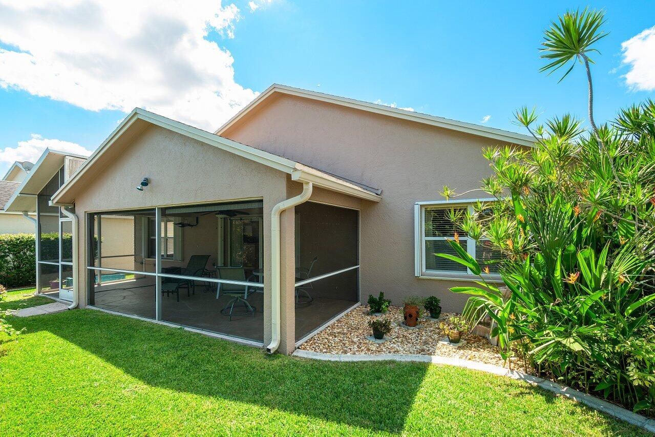 1410 Bethpage Way Greenacres, FL 33413 - Photo 29 of 29 a view of a house with backyard and a garden