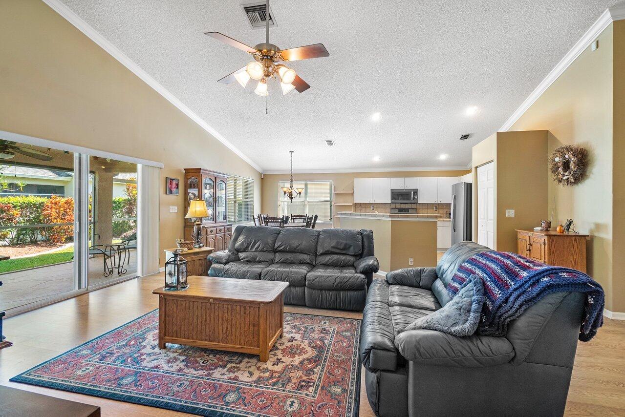 1410 Bethpage Way Greenacres, FL 33413 - Photo 4 of 29 a living room with furniture and a large window