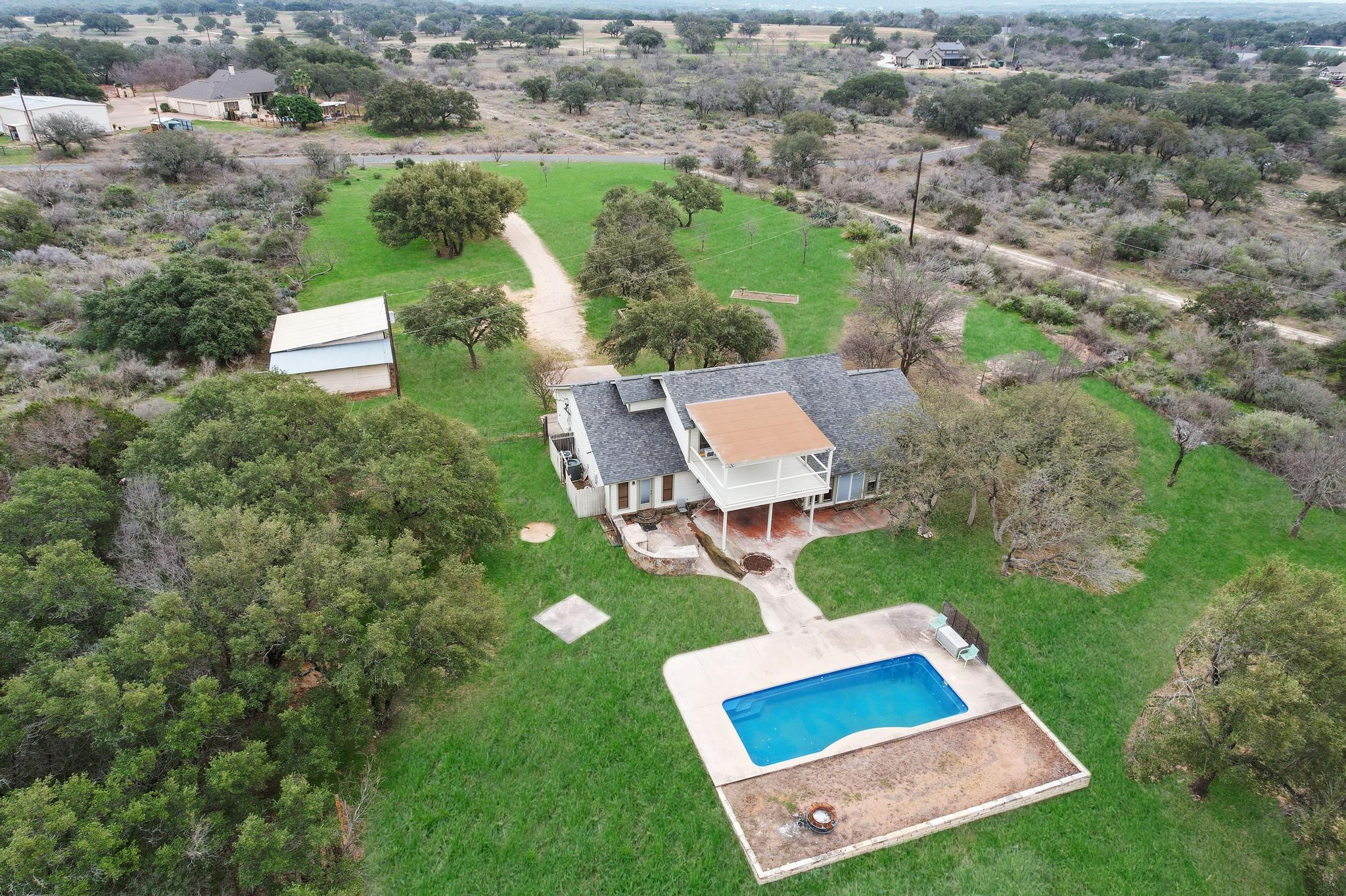 226 Mels Road Spicewood, TX 78669 - Photo 1 of 1 an aerial view of a house