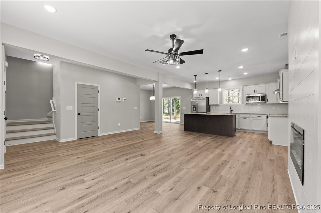 15980 Old Orchard Court Wagram, NC 28396 - Photo 17 of 33 a view of kitchen with wooden floor and window