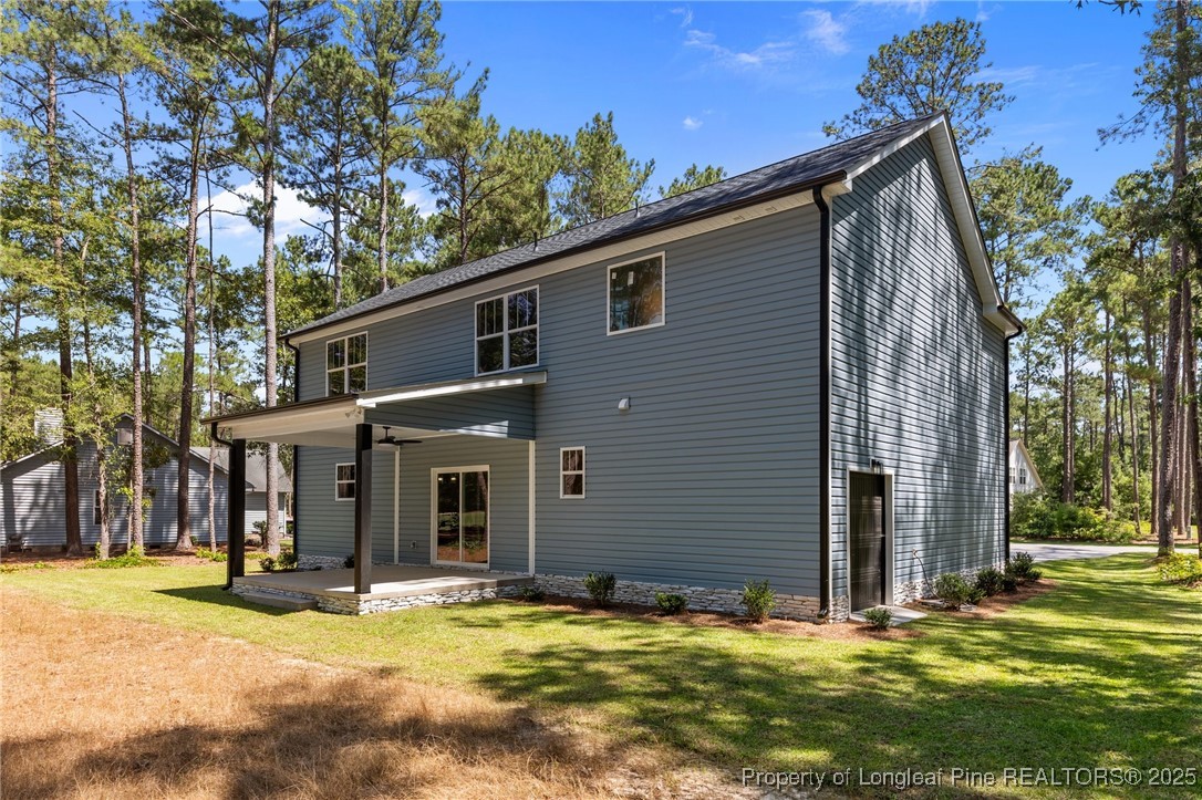 15980 Old Orchard Court Wagram, NC 28396 - Photo 2 of 33 a view of a house with a yard and tree s