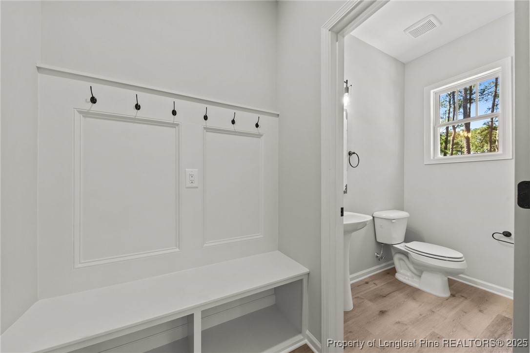 15980 Old Orchard Court Wagram, NC 28396 - Photo 21 of 33 a bathroom with a toilet and a shower