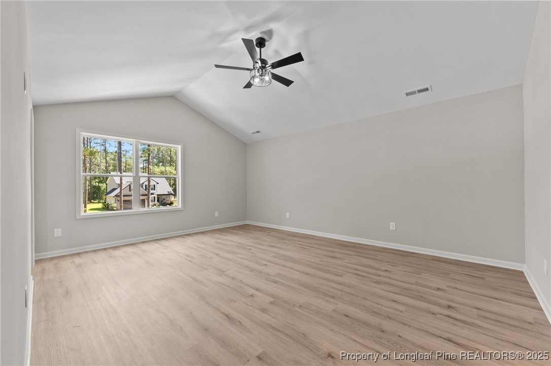 15980 Old Orchard Court Wagram, NC 28396 - Photo 23 of 33 wooden floor in an empty room with a window