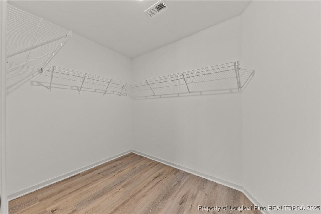 15980 Old Orchard Court Wagram, NC 28396 - Photo 24 of 33 a view of a room with empty racks