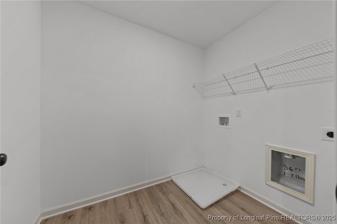 15980 Old Orchard Court Wagram, NC 28396 - Photo 31 of 33 a view of small space with racks on the wall