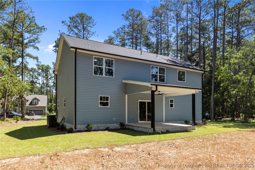 15980 Old Orchard Court Wagram, NC 28396 - Photo 4 of 33 a view of a house with a yard and garage