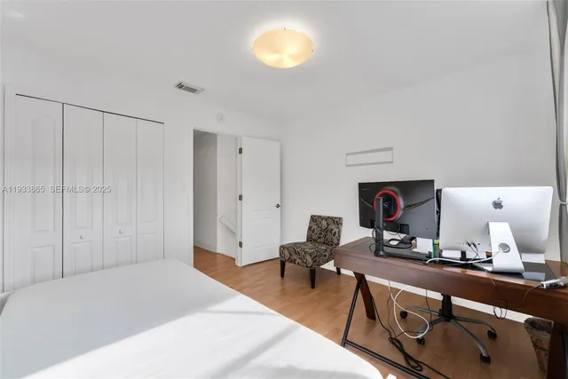 a bathroom with a granite countertop sink a toilet and a bathtub