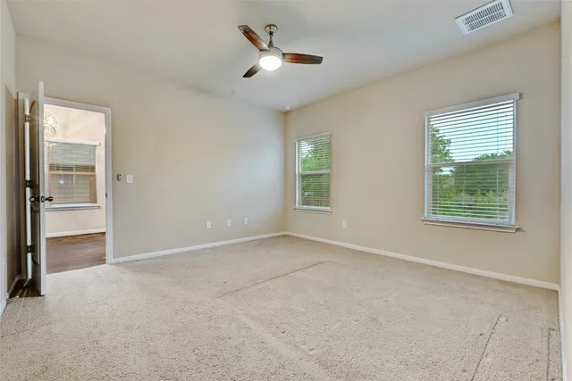 a view of a kitchen with a sink a cabinet and dishwasher a refrigerator with wooden floor