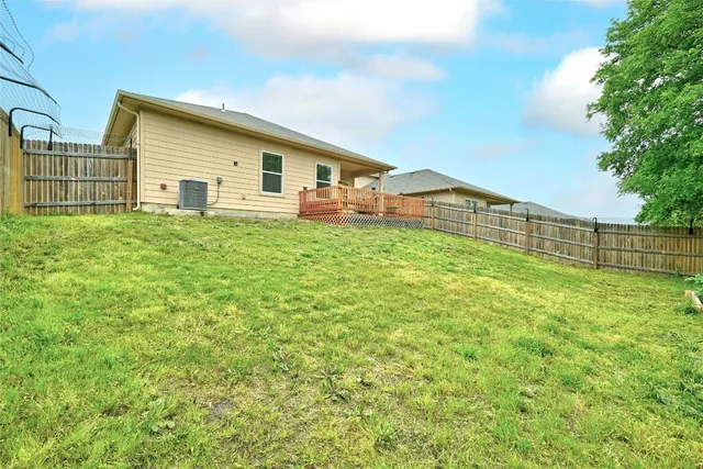 a view of deck with a table and chairs with wooden floor