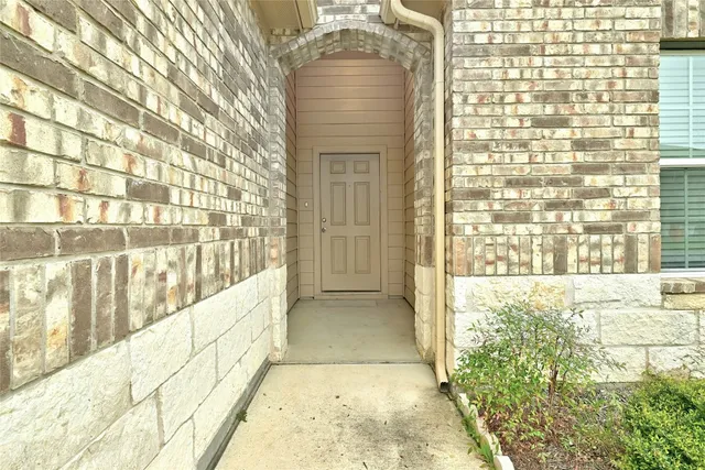 a view of a kitchen with a sink and a fireplace