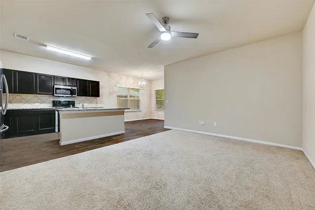 a swimming pool with outdoor seating and garden