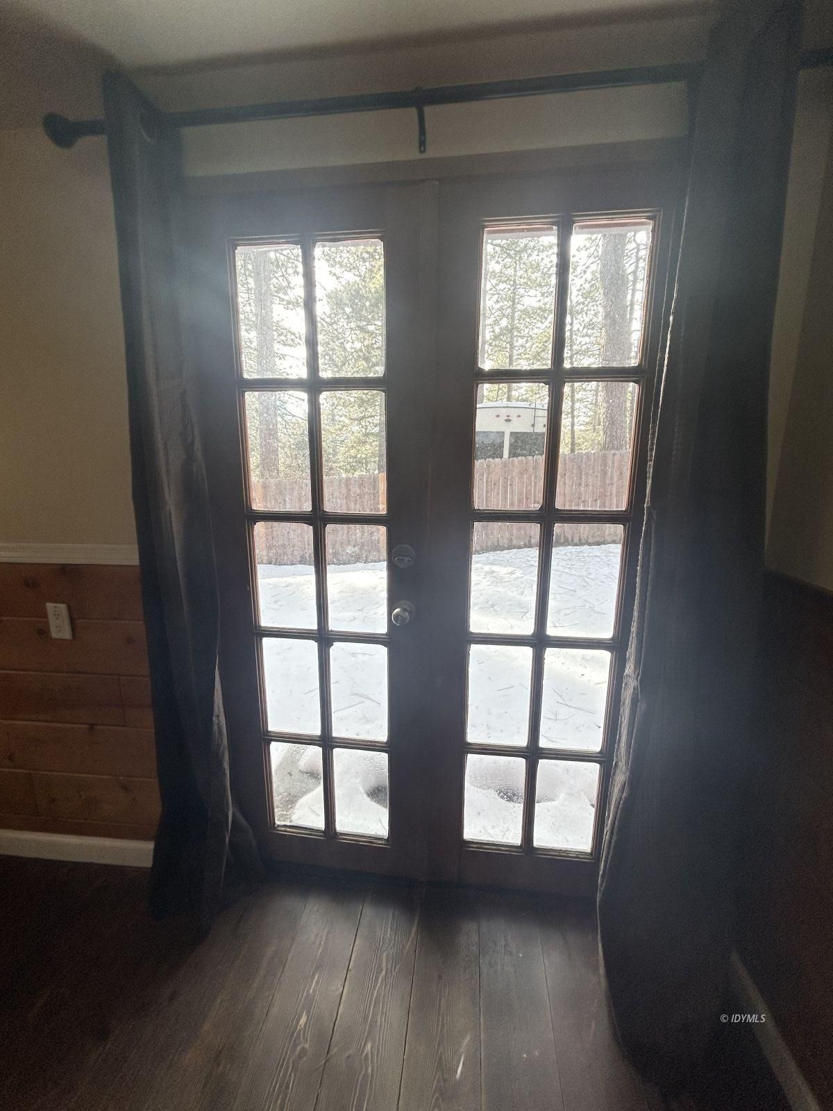 25055 Marion Ridge Drive, Unit 5 Idyllwild, CA 92549 - Photo 13 of 15 an empty room with wooden floor and windows