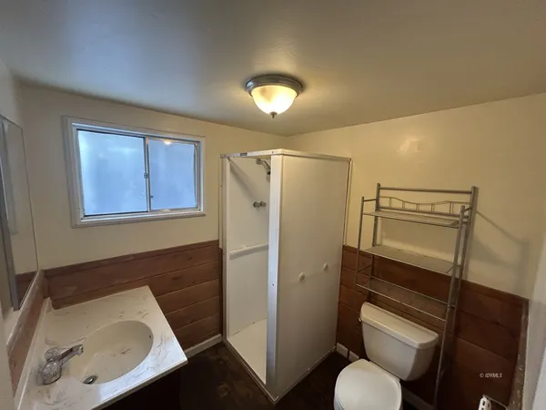 a utility room with sink dryer and washer