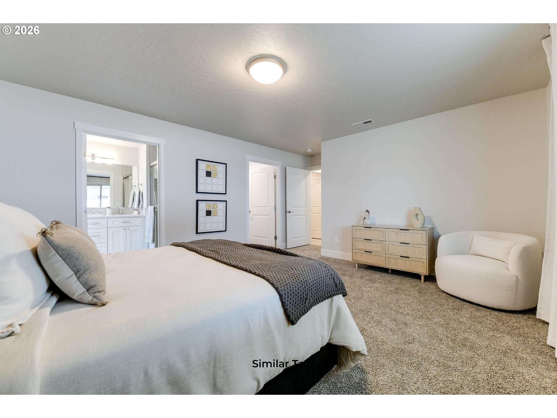 227 Southwest Goldfinch Lane Boardman, OR 97818 - Photo 18 of 28 a bedroom with a bed and a couch