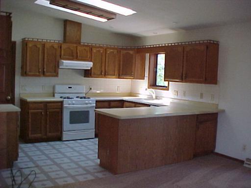 9-n047 Barron Road Maple Park, IL 60151 - Photo 7 of 16 a kitchen with stainless steel appliances granite countertop a stove a sink and a refrigerator