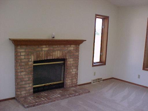 9-n047 Barron Road Maple Park, IL 60151 - Photo 8 of 16 a living room with a fireplace in it