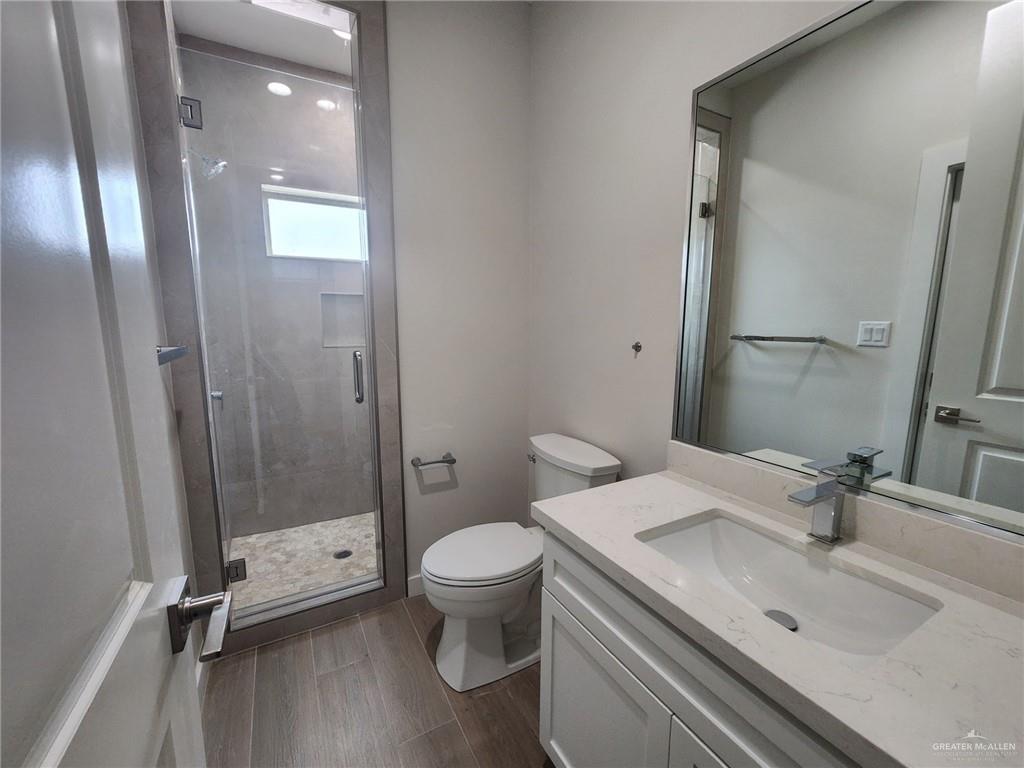 2529 Trinity Avenue McAllen, TX 78504 - Photo 12 of 21 a bathroom with a sink a toilet and shower