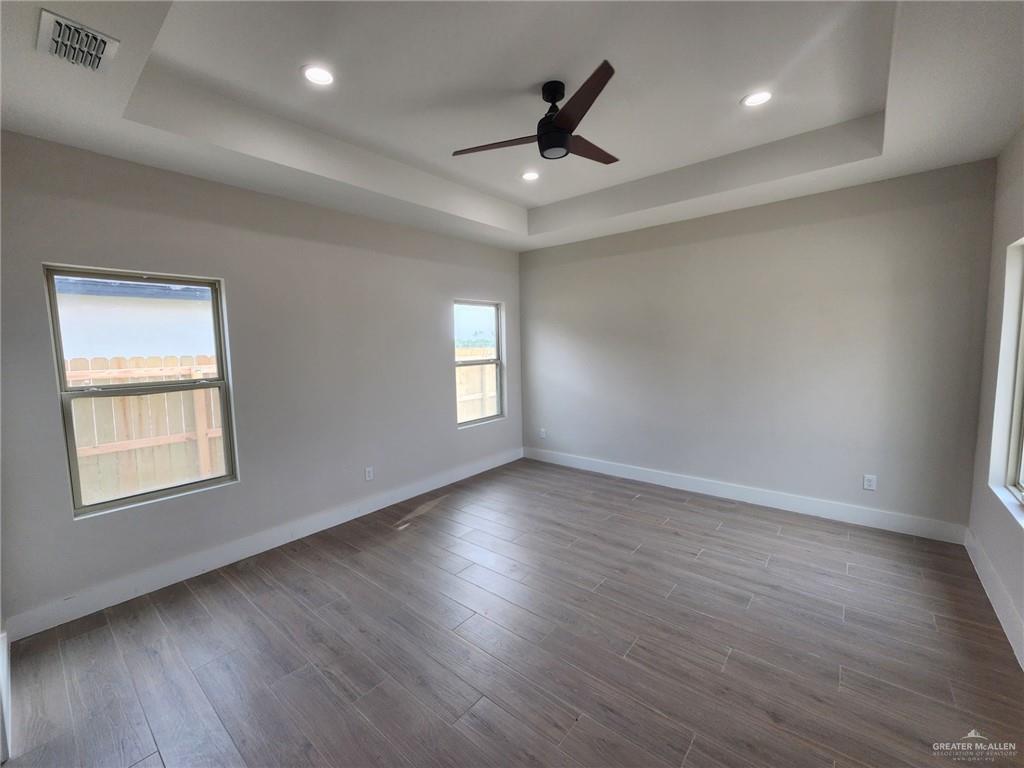 2529 Trinity Avenue McAllen, TX 78504 - Photo 16 of 21 a view of an empty room with wooden floor and a window
