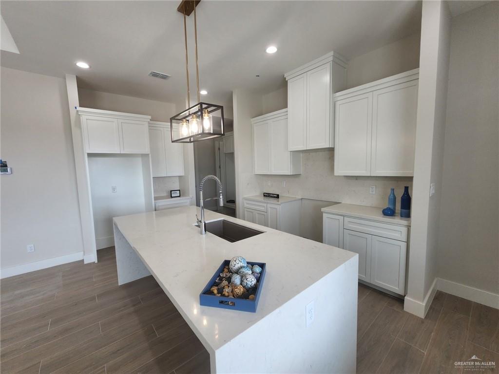 2529 Trinity Avenue McAllen, TX 78504 - Photo 7 of 21 a kitchen with sink cabinets and counter top space
