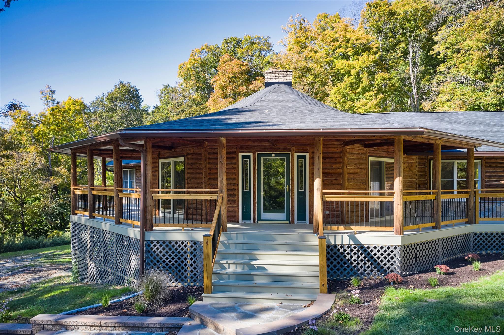 568 Oak Summit Road Millbrook, NY 12545 - Photo 11 of 50 View of front of property featuring covered porch, a shingled roof, and a chimney