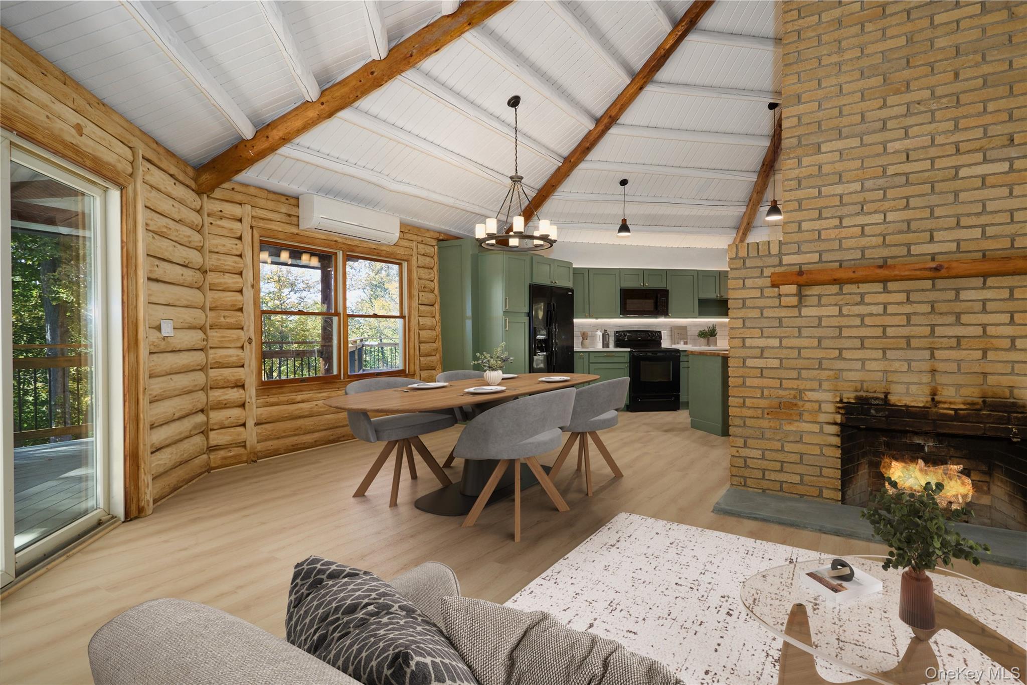 568 Oak Summit Road Millbrook, NY 12545 - Photo 15 of 50 Dining room with a fireplace, beamed ceiling, a chandelier, light wood-style flooring, and high vaulted ceiling