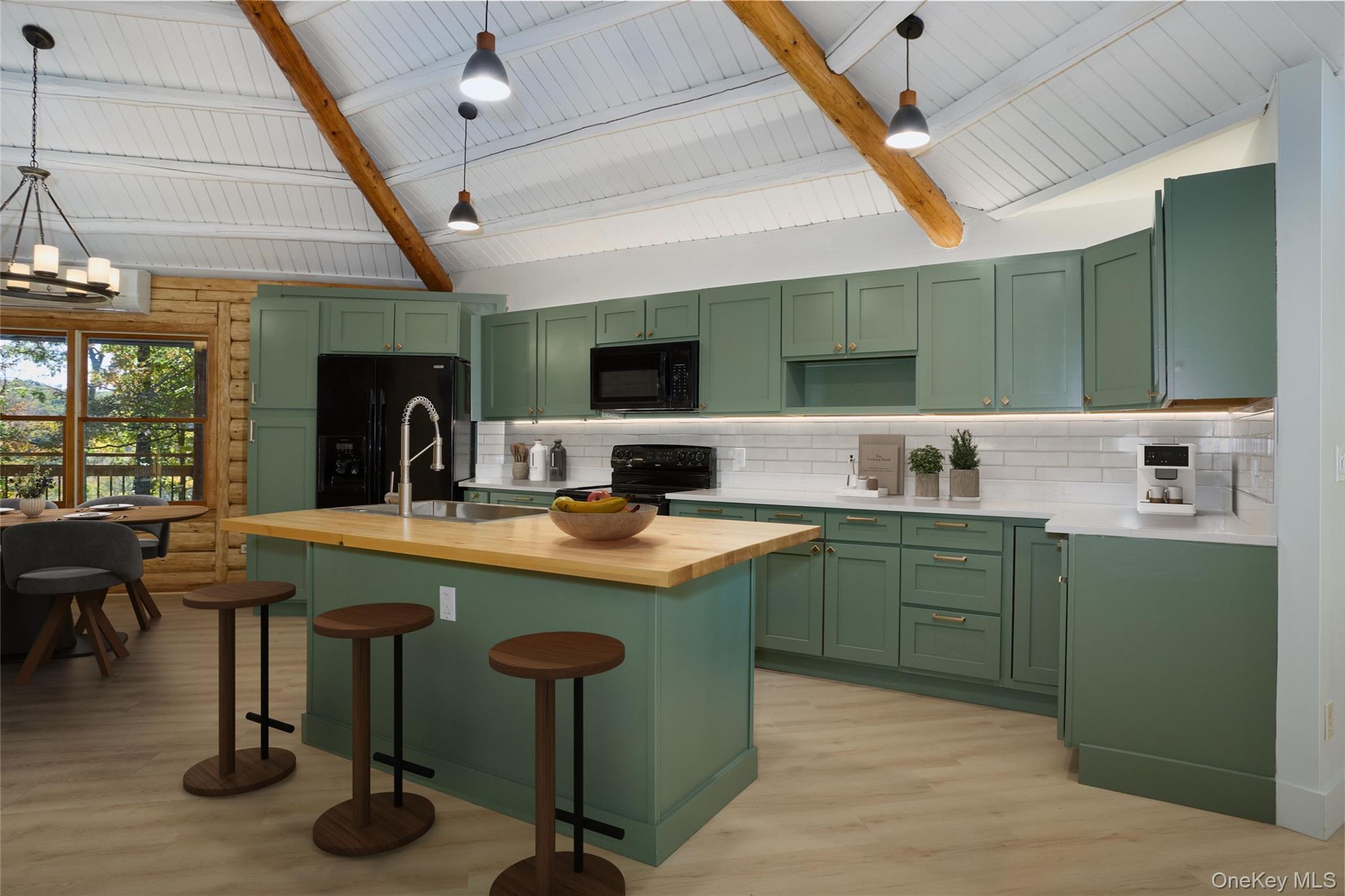 568 Oak Summit Road Millbrook, NY 12545 - Photo 18 of 50 Kitchen with green cabinetry, butcher block countertops, tasteful backsplash, light wood-type flooring, and a kitchen island with sink