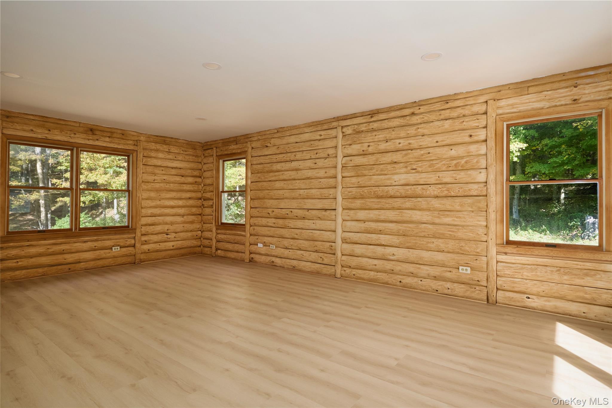 568 Oak Summit Road Millbrook, NY 12545 - Photo 27 of 50 Unfurnished room with wood finished floors and log walls