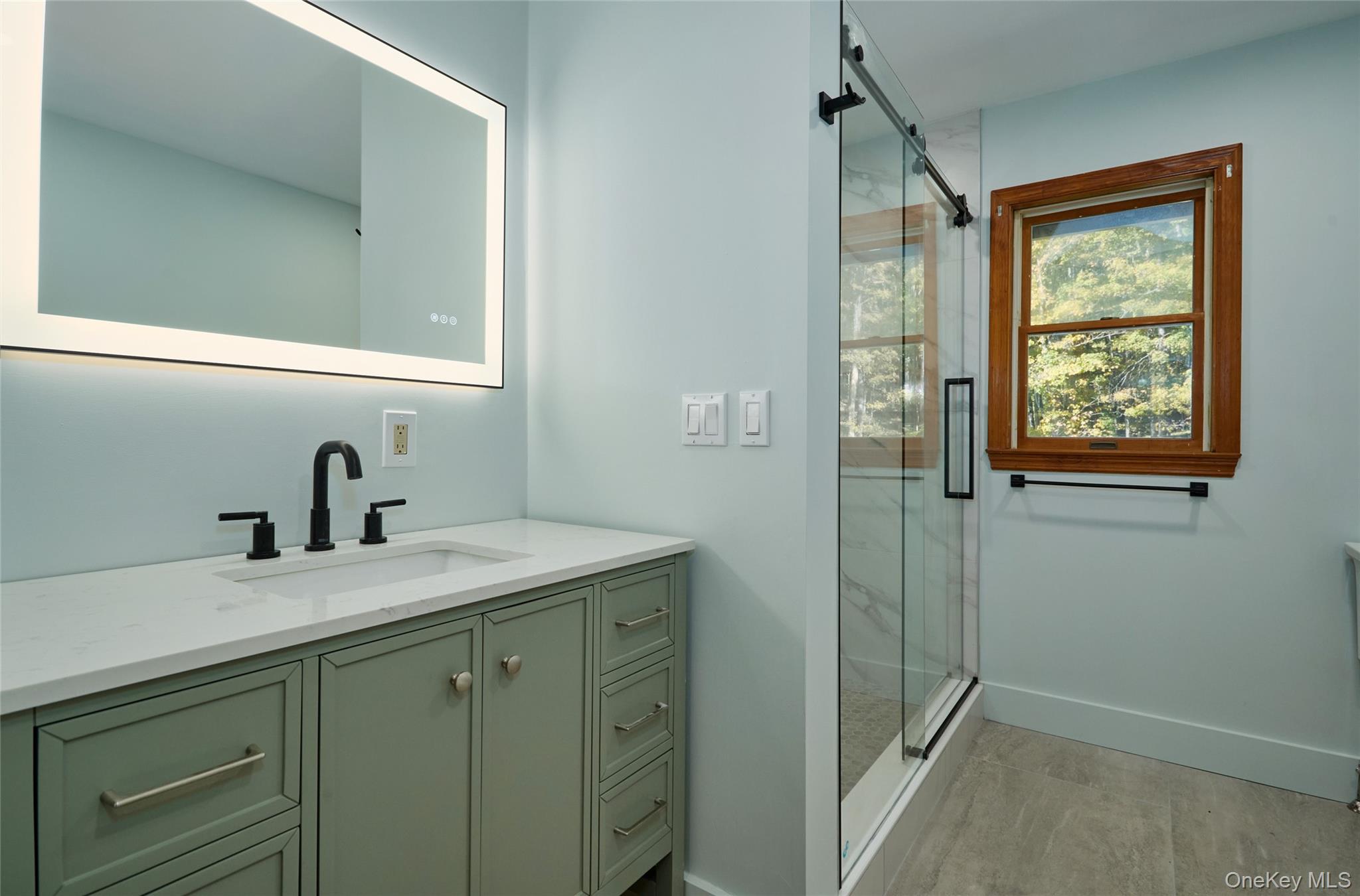 568 Oak Summit Road Millbrook, NY 12545 - Photo 28 of 50 Bathroom featuring vanity and a marble finish shower