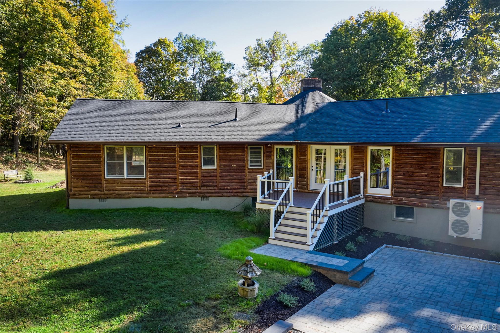 568 Oak Summit Road Millbrook, NY 12545 - Photo 48 of 50 View of front of house with crawl space, a chimney, a shingled roof, a front yard, and a deck