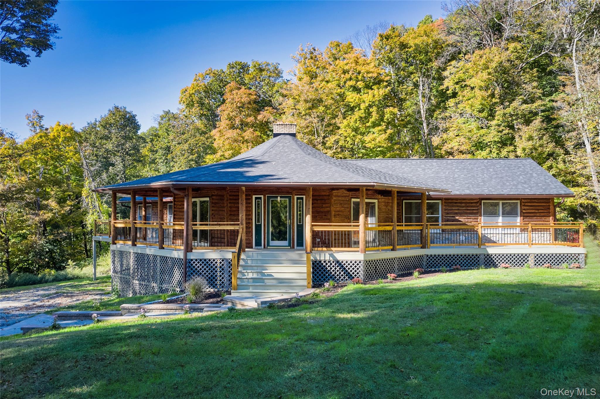 568 Oak Summit Road Millbrook, NY 12545 - Photo 6 of 50 Front view of property featuring a porch, a chimney, a yard, and a shingled roof