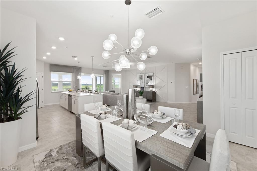 6008 Ellerston Way Avenue, Unit 1021 Immokalee, FL 34142 - Photo 20 of 50 Dining room with recessed lighting, light tile patterned flooring, and a chandelier